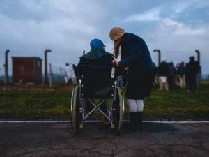 man on a wheelchair after a catastrophic injury