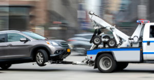 a tow truck with a car to tow