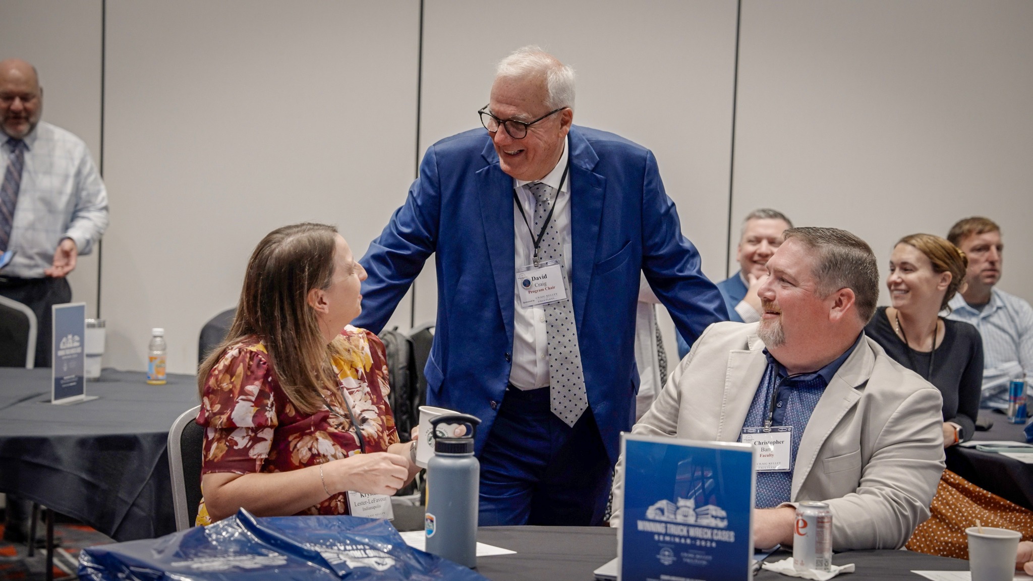 David Craig greeting coworker Christopher Barry and Mrs. Barry