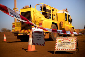 truck at a construction zone with cautionary tape around it