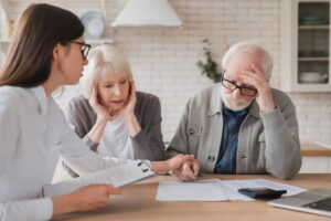 Elderly couple meeting with their lawyer