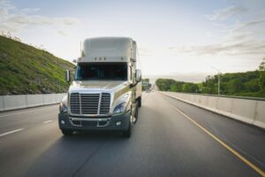 White truck driving on road