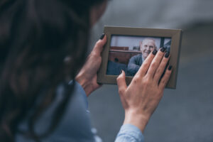 Woman holding a picture of a loved one