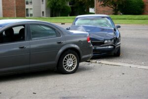 Two cars parked after colliding