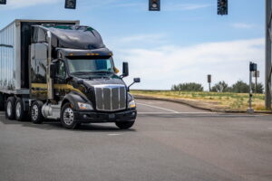 Black truck making an illegal turn