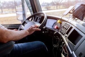 Trucker looking at his phone while driving