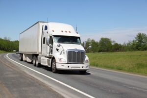 White truck drives down the road