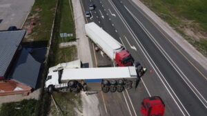 two crashed trucks on a highway